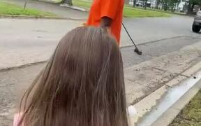 Little Girl Gives Cold Water to Workers