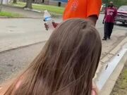 Little Girl Gives Cold Water to Workers
