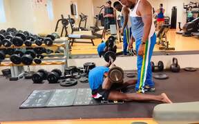 Man Lifts Heavy Weight While Doing An Exercise