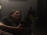 Husky Howls Along With Owner