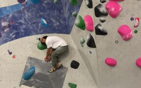 Man Falls Hard During Gym Wall Climbing