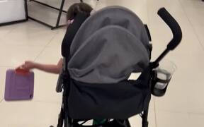 Little Girl Runs Around The Mall
