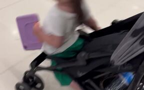 Little Girl Runs Around The Mall