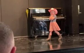 Kid Drops Mic Stand Twice While Performing 