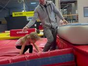Little Girl Does Gymnastic Training With Dad