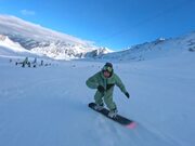 Man Does Snowboarding Tricks at Resort