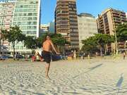 Man Does Multiple Slacklining Tricks at Beach