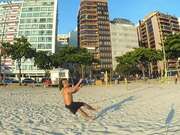 Man Does Multiple Slacklining Tricks at Beach