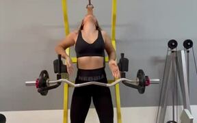 Woman Does Barbell Curls