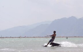 Dog Runs Behind Owner While He Does Kitesurfing - Animals - Videotime.com
