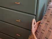 Woman Refurbishes Old Dresser
