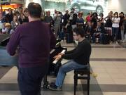 Duo Sings and Plays Piano for Crowd in Airport