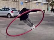 Street Artist Displays Amazing Skills on Cyr Wheel