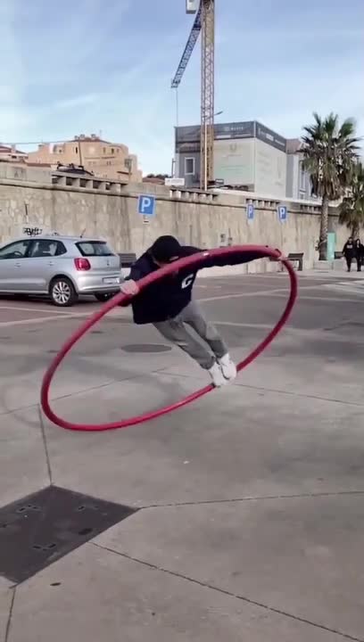 Street Artist Displays Amazing Skills on Cyr Wheel