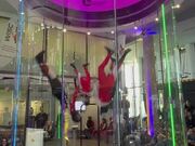 People Participate in Indoor Skydiving Competition