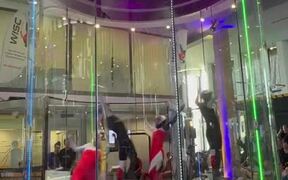 People Participate in Indoor Skydiving Competition