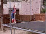 Kid Wearing Superhero Costume Does Tricks
