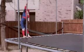 Kid Wearing Superhero Costume Does Tricks