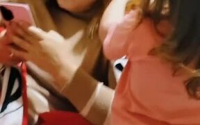 Kid Trims Mom's Hair While She's Busy on Phone