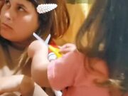 Kid Trims Mom's Hair While She's Busy on Phone