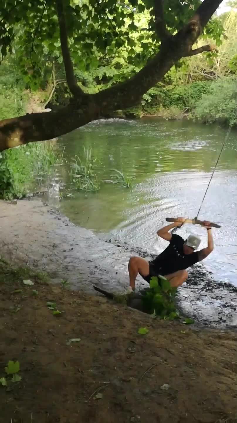 Man Slips and Falls While Swinging on Rope