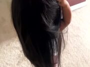 Kid Acts Funny and Poses While Wearing Mom's Wig