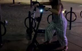Woman Trying to Ride Scooter Crashes Into Pole