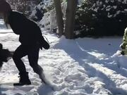 Dog and Woman Enjoy Playtime in Snow