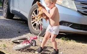 Toddler Takes Chicken on Ride on His Bike
