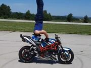 Guy Does Headstand on His Moving Motorbike