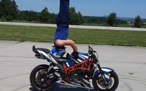 Guy Does Headstand on His Moving Motorbike