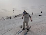 Skier Juggles Football While Performing Tricks