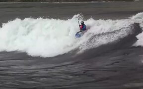 Man Rides Strong Waves in Kayak