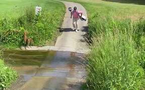 Guy Carrying Golf Bag Across Stream Slips &Falls