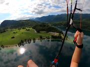 Person Goes for Paragliding Near Lake Bohinj