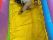 Father Saves Son From Falling Off Inflatable Slide