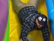Father Saves Son From Falling Off Inflatable Slide