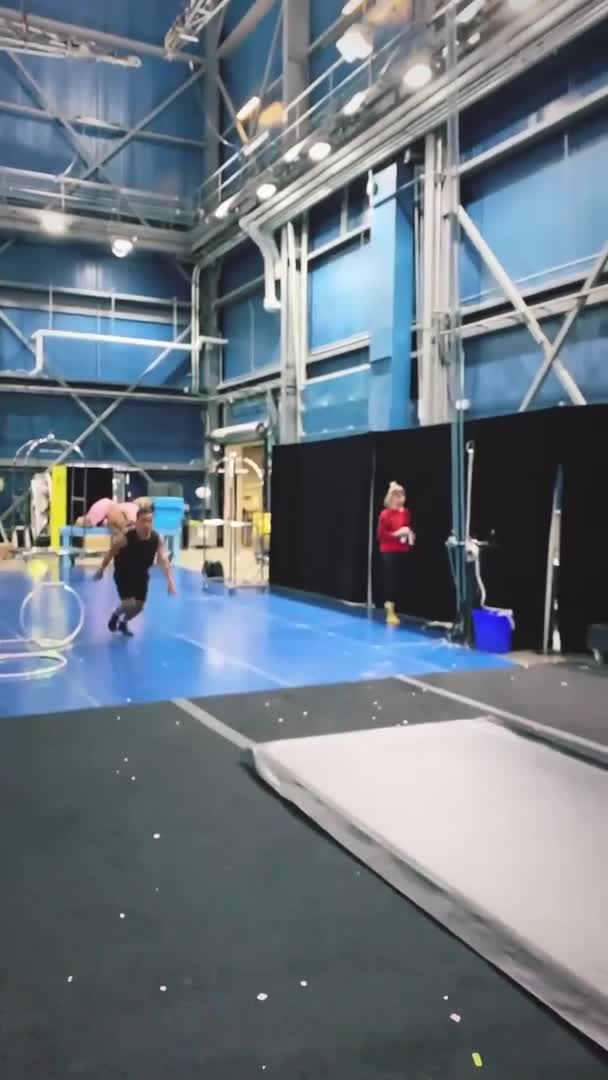 Guy Jumps Through Ring to Attempt Acrobatic Trick