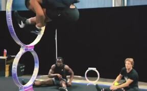 Guy Jumps Through Ring to Attempt Acrobatic Trick
