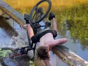 Guy Falls in Water While Riding His Bike