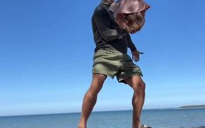 Kid Balances Head on Dad's Hand and Does Headstand