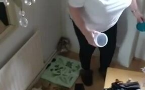 Woman Fails to Catch Mouse in Container