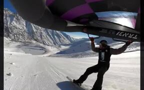 Man Kite Surfs on Snow