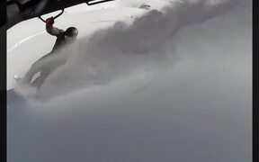 Man Kite Surfs on Snow