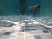 Duo Performs Unique Underwater Workout