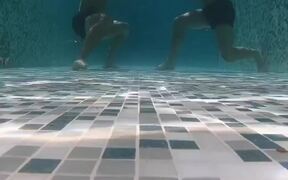 Duo Performs Unique Underwater Workout