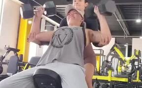 Person Drops Dumbbell on Their Face