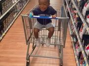 Kid Sitting Inside a Cart Laughs Hysterically