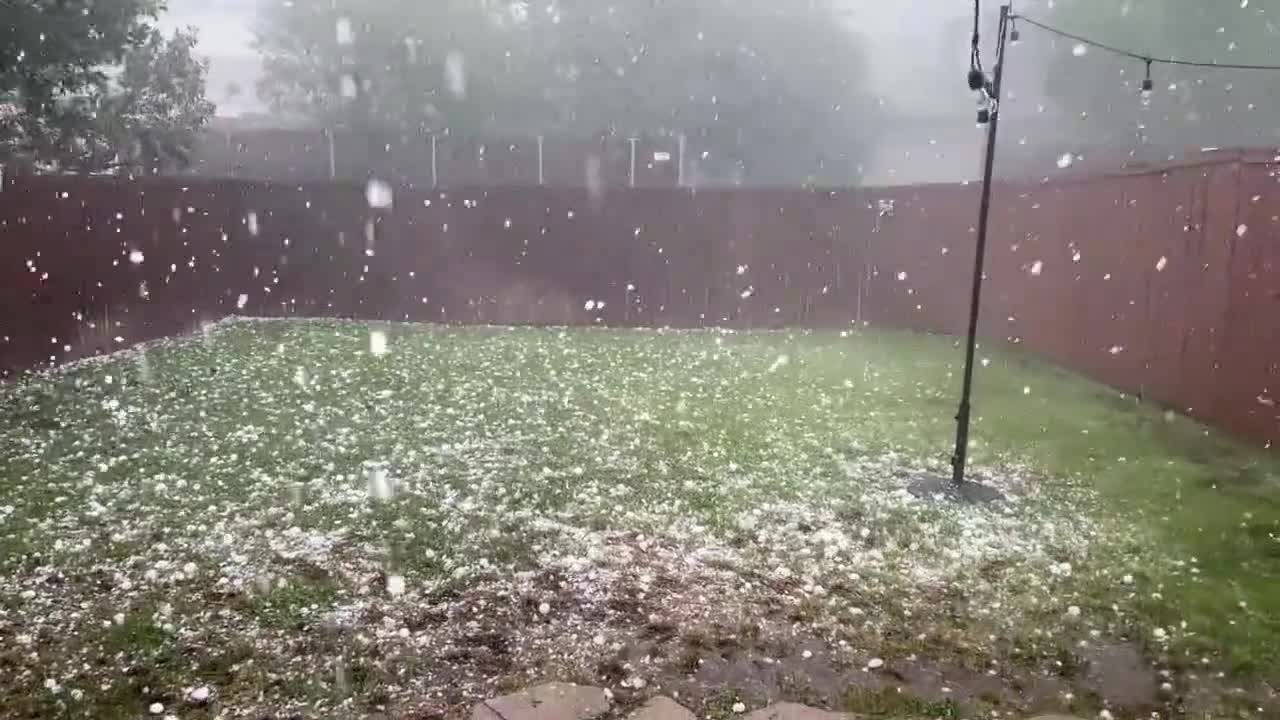 Person Watches Heavy Hailstorm Cover Backyard