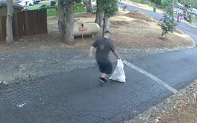 Man With Trash Plastic Bag Accidentally Spills It